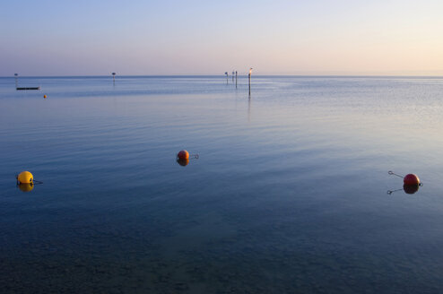 Germany, Immenstaad, Lake Constance, Buoy in lake at dusk - SMF00583