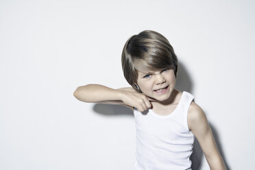 Boy (8-9) gesturing against white background - PDF00021