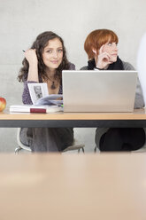 Germany, Leipzig, University students studying and using laptop - BABF00549