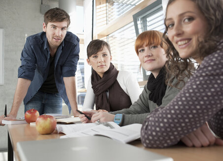 Germany, Leipzig, University students studying together, smiling, portrait - BABF00543