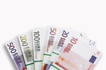 Bundles of Euro banknotes on white background, close-up - 13106CS-U