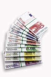 Bundles of Euro banknotes on white background, close-up - 13104CS-U