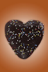 Heart shape cookie against coloured background - TLF00483