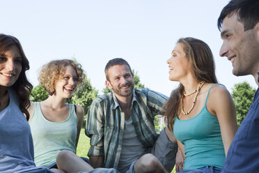 Germany, Munich, Man and woman sitting together and smiling - LDF000891