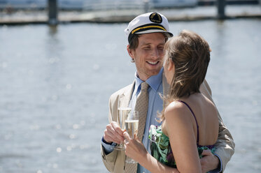 Germany, Hamburg, Couple drinking champagne, smiling - WESTF015238