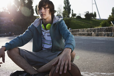 Germany, Berlin, Teenage boy with headphones - WESTF015332