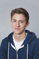 Germany, Berlin, Teenage boy smiling, portrait - BAEF000088