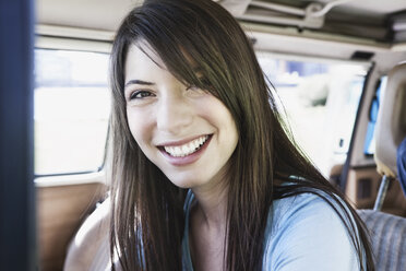 Germany, Cologne, Young woman smiling, portrait - JOF000111