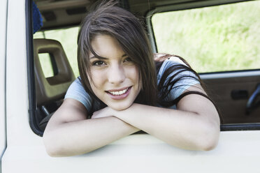 Germany, Cologne, Young woman smiling, portrait - JOF000124