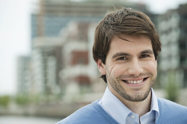 Germany, Hamburg, Businessman smiling, portrait - WESTF015389