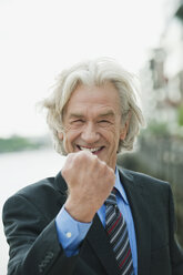 Germany, Hamburg, Businessman smiling, portrait - WESTF015417