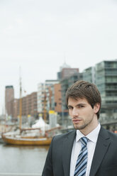 Germany, Hamburg, Businessman at harbour, portrait - WESTF015449
