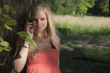 Germany, Dortmund, Young woman on the phone - SKF000261