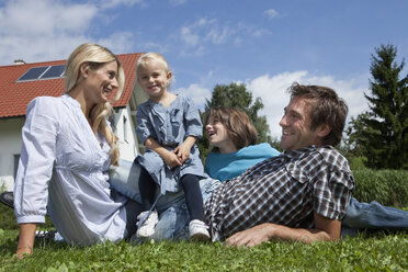 Germany, Munich, Family in garden, smiling - RBF000405