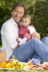 Germany, Bavaria, Father and baby girl (2-5 months) having picnic - MAEF002580