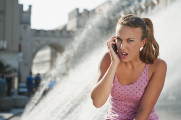 Germany, Munich, Karlsplatz, Young woman on the phone - RNF000427