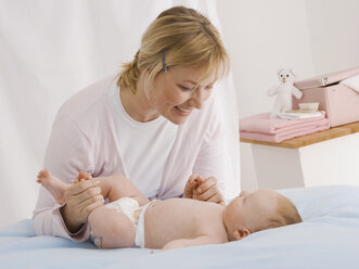 Germany, Mother playing with baby boy (2-5 Months) - WBF000443