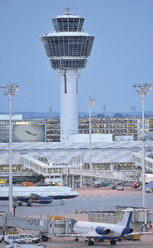 Germany, Munich, Air traffic control tower with airplanes - WBF000106