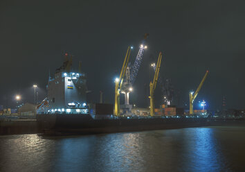 Germany, Hamburg, Container ship in water at steinwerder port - WBF000527