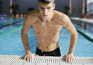 Romania, Bucharest, Man getting out of pool - WBF000785