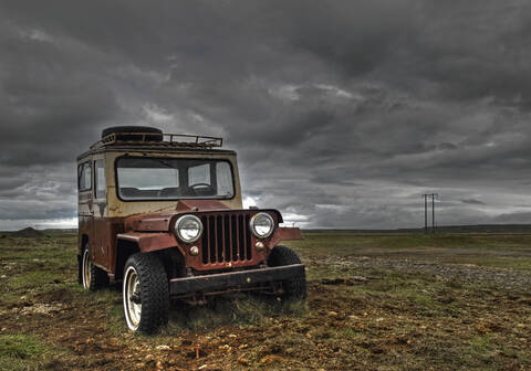 Iceland, Old jeep on rough landscape stock photo