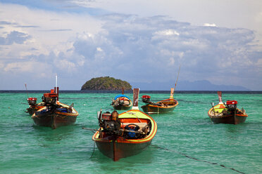 Thailand, Longtail Boat floating on water - NDF000166