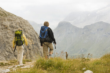 Italy, Dolomites, Mountain hikers hiking at Pordoi - RNF000556