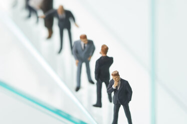 Businesspeople figurines discussing together - ASF004183