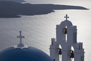 Greece, Cyclades, Thira, Santorini, Bell tower and dome of a church firostefani with aegean sea - FOF002708