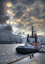 Germany, Hamburg, View of tugs at harbour in winter - WBF000451