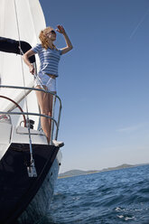 Croatia, Zadar, Young woman looking out from sailboat - HSIF000081