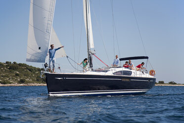 Croatia, Zadar, Friends relaxing on sailboat - HSIF000084