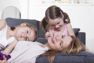 Mother and daughters having fun - RBF000456