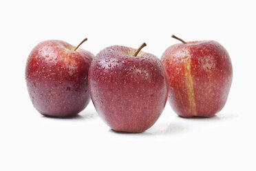 Three red apples on white background - MAEF002833