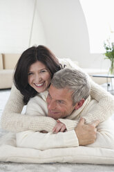 Germany, Munich, Mature couple at home, smiling - NHF001302