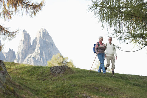 Italy, South Tyrol, Mature couple hiking on dolomites - WESTF015954