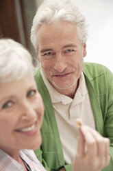 Italy, South Tyrol, Mature couple at guesthouse, smiling, portrait - WESTF016040