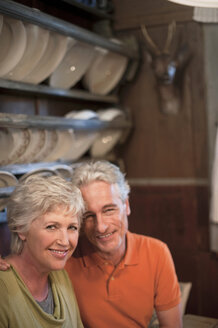 Italy, South Tyrol, Mature couple at guesthouse, smiling, portrait - WESTF016057