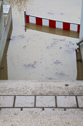 Germany, Wuerzburg, View of flood water near stairway and barrier - ND000178