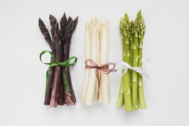 Bundle of various asparagus on white background - GWF001376