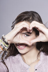 Girl makes a heart with her hands, portrait - WESTF016119