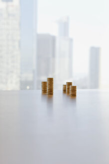 Germany, Frankfurt, Stack of coins in office - SKF000420