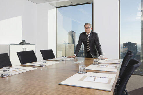 Germany, Frankfurt, Businessman in conference room - SKF000475