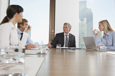 Germany, Frankfurt, Business people discussing in conference room - SKF000536