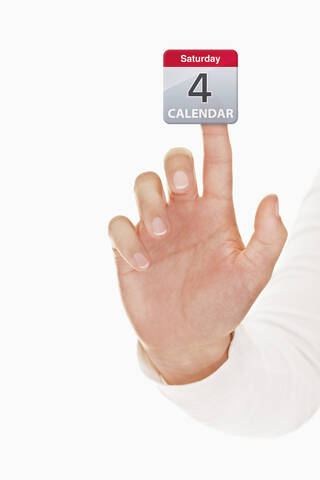 Menschliche Hand berührt Kalender-Symbol, lizenzfreies Stockfoto