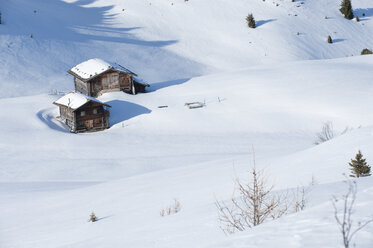 Austria, South Tirol, View of huts in snow - MRF001219