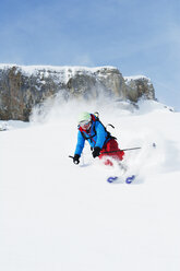 Austria, Kleinwalsertal, Woman skiing - MRF001244