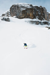 Austria, Kleinwalsertal, Man skiing, elevated view - MRF001283