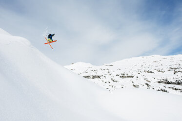 Austria, Kleinwalsertal, Male skier jumping mid-air - MRF001284