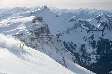 Austria, Kleinwalsertal, man skiing on mountain - MRF001287